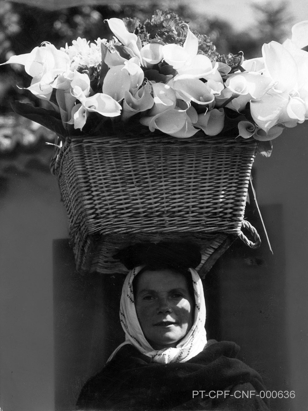 Lady, Basket of Calla Lilies on Head (Portugal), 1930s; PT/CPF/CNF/000636